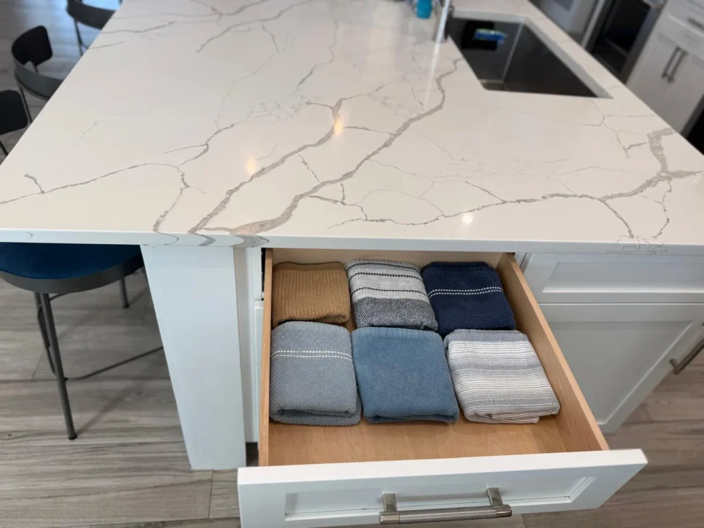 Neatly folded towels organized in a kitchen drawer after a deep cleaning service in the Florida Keys