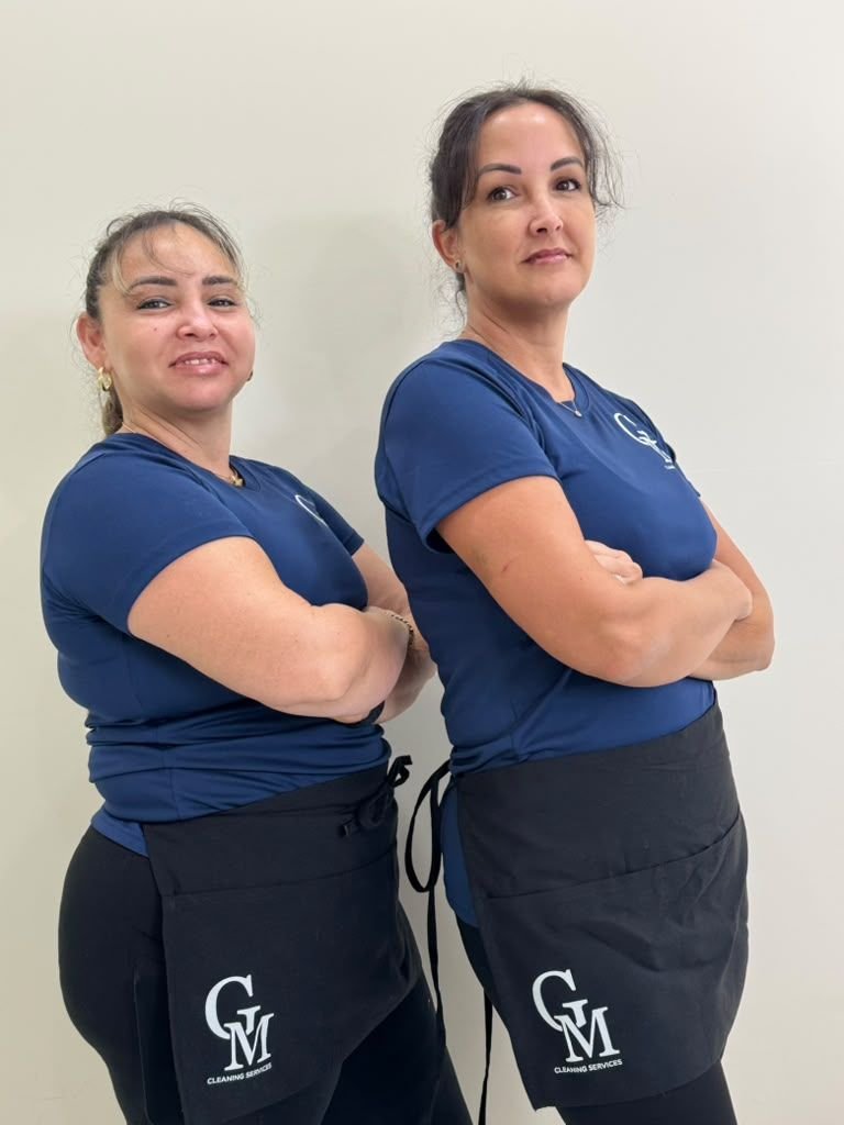 Two Cleaning Services GM team members in branded uniforms, Florida Keys